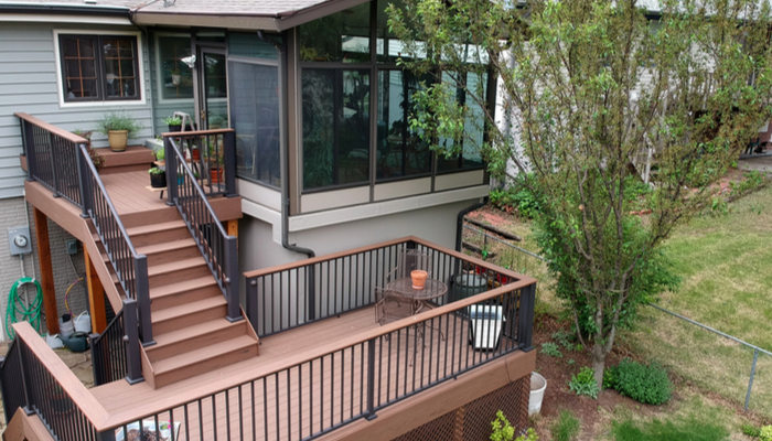 Home with sunroom and composite deck