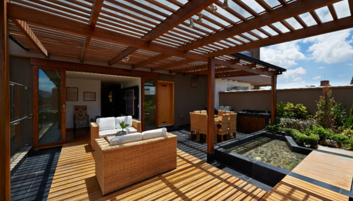 Beautiful terrace lounge with pergola on a lovely sunny day