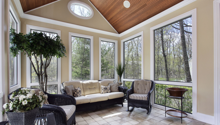 Sunroom in luxury home with circular window at the top