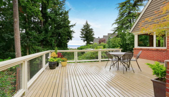 deck or patio and sitting area on spacious walkout deck overlooking bay in the summer